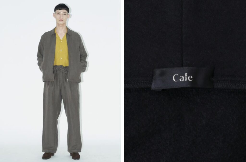 CALE(カル)のセットアップを着用したモデル。ミニマルなジップジャケットとワイドパンツのコーディネート正面画像とブランドタグ