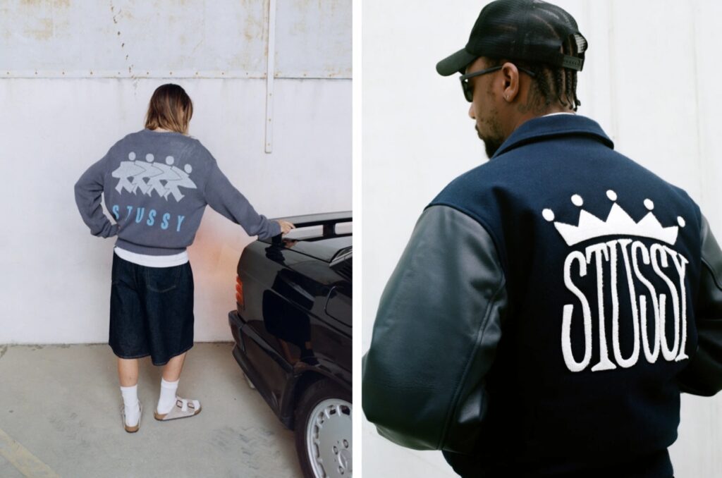 STUSSY(ステューシー)のロゴ入りアウターを着たモデル2名のバックショット。クラウンロゴやシンボリックなグラフィックが見えるストリートウェアのイメージ写真。